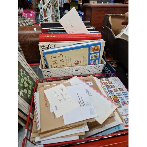 291 - A box of stamp books and albums and a tray of assorted covers.