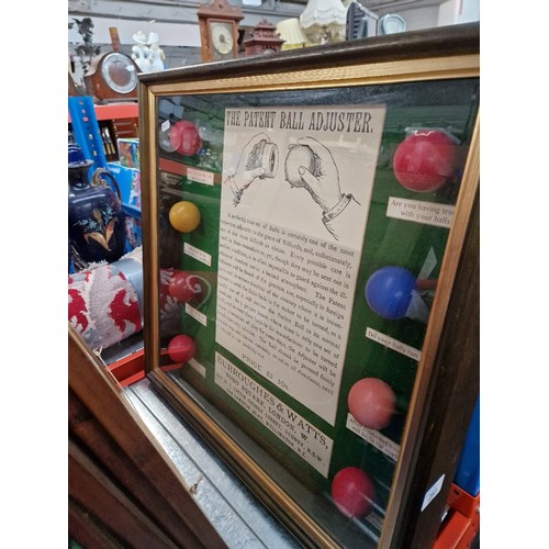 293 - A display of billiard balls and 4 related billiard photographs.