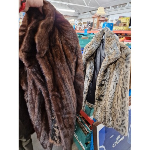 297 - A vintage fur coat and a faux fur jacket.