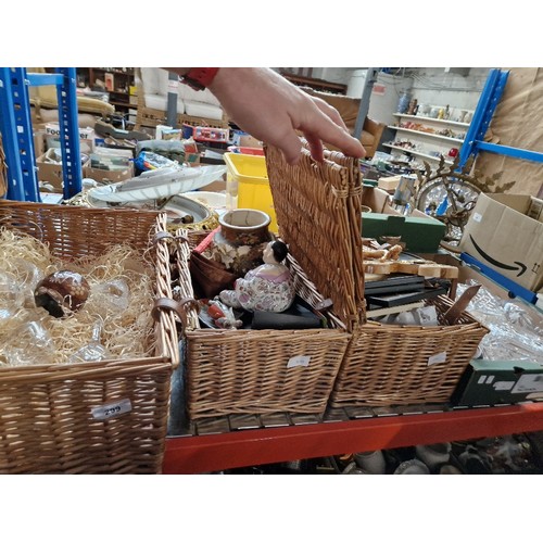 299 - 3 wicker hampers and a box of glass decanters, pottery, glasses.