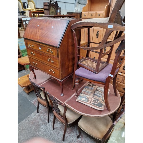 975 - Various items of furniture; mahogany bureau, side cabinet, two chairs and a mahogany extending dinin... 