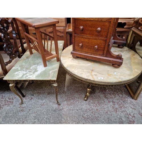 974 - Two brass and onyx top coffee tables and a gilt framed mirror.