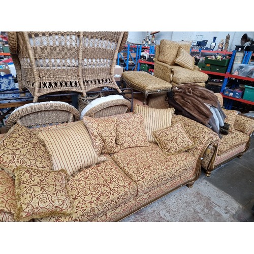 982 - A five piece suite comprising three seater sofa, two seater sofa, two armchairs and a footstool.