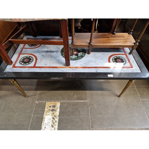 945 - An Italian Pietra Dura marble and gilt metal coffee table.