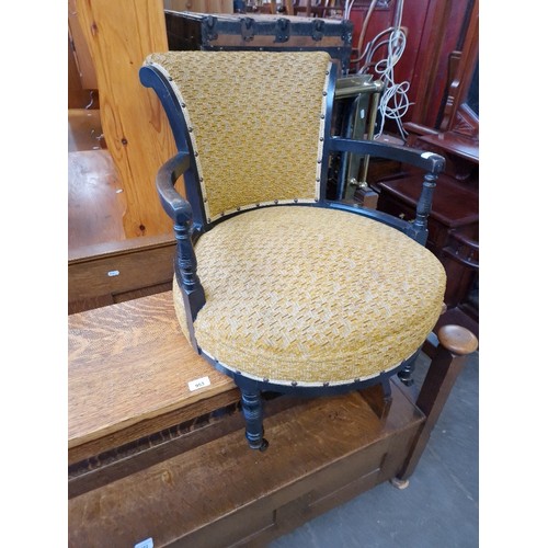 954 - A late Victorian Aesthetic movement ebonised tub chair.