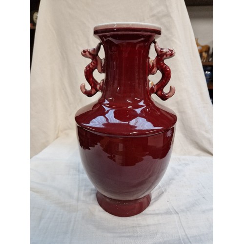 576 - A Chinese sang de boeuf vase with six character mark to base, height 32cm.