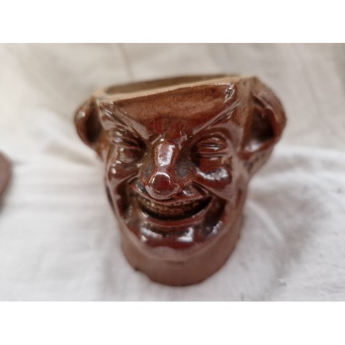 468 - A salt glaze 'Laughing Puritan' tobacco jar - as found