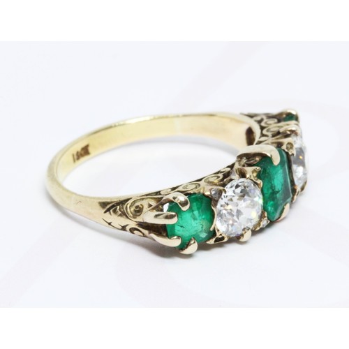 34 - A diamond and emerald ring, two old cut diamonds weighing approximate 0.53 & 0.58 carats, set betwee... 