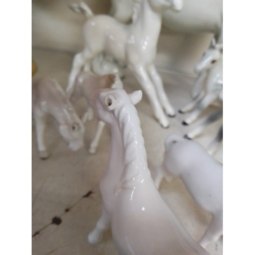 646 - 4 dappled grey Beswick horse figures including Shire horse, together with four small unmarked horse ... 