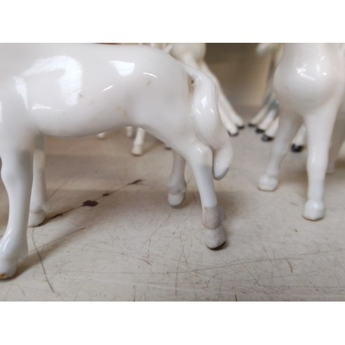 646 - 4 dappled grey Beswick horse figures including Shire horse, together with four small unmarked horse ... 