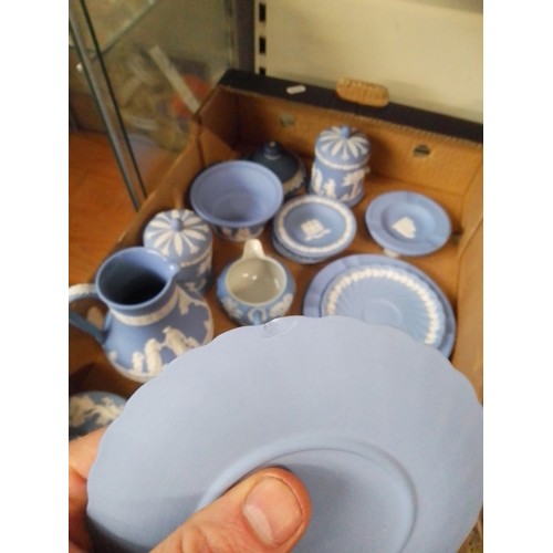 669 - A box of blue Wedgwood jasperware.