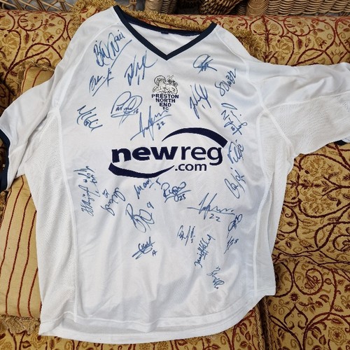 132 - A collection of Preston North End memorabilia, various autographed items, shirts, caricatures, progr... 