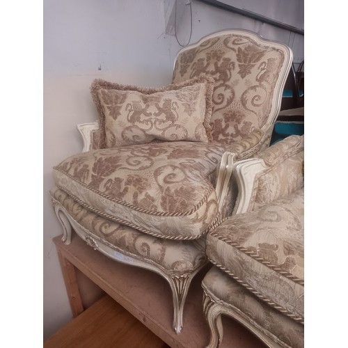 882 - A pair of French style armchairs.