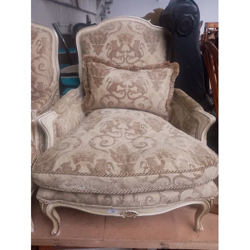 882 - A pair of French style armchairs.