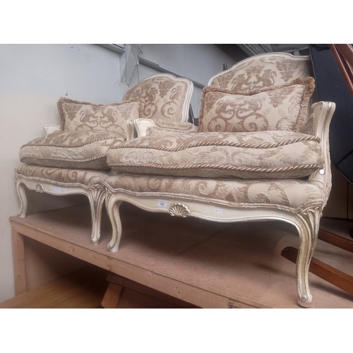 882 - A pair of French style armchairs.