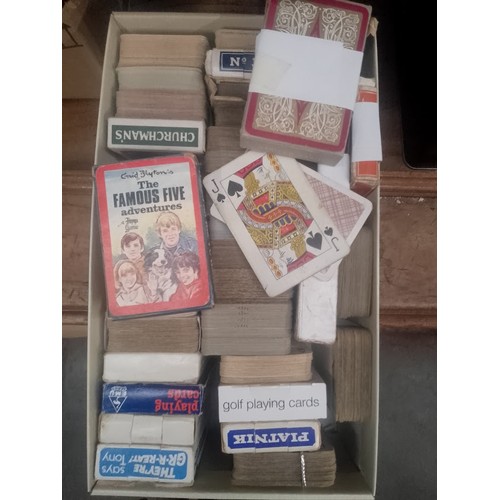 29 - Four boxes of vintage playing cards, etc.