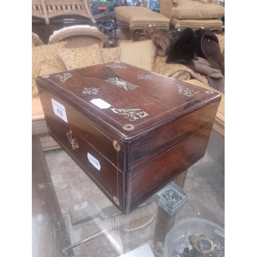 438 - A 19th century rosewood and mother of pearl jewellery/sewing box.