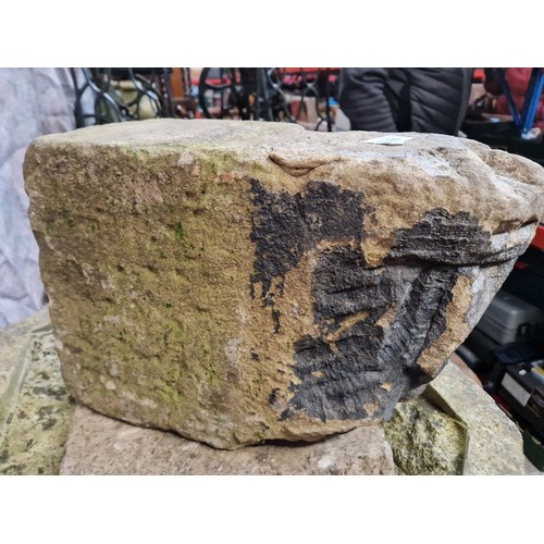 289 - A stone carving of Jesus on plinth.