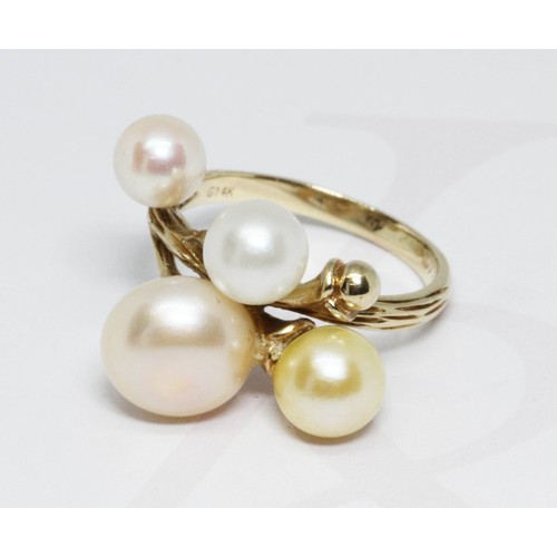 68 - A cultured pearl cluster ring, marked 'G14K', gross weight 6.2g, size O.