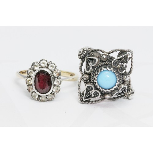 66 - A garnet cluster ring marked '9ct' weight 2.3g, and a white metal ring set with a turquoise cabochon... 