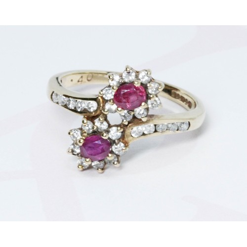 192 - A hallmarked 9ct gold diamond and ruby cluster ring, gross weight 2.5g, size L/M.