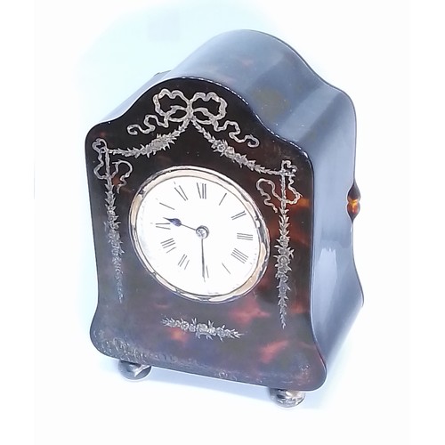 261 - An Edwardian silver inlaid tortoiseshell mantle clock, hallmarked silver hinged back, sponsor 'H.A&O... 