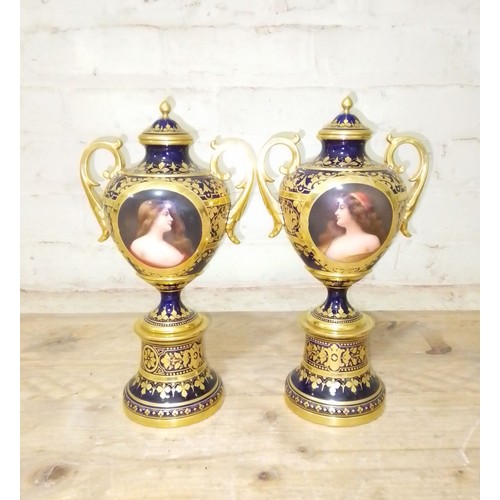 266 - A pair of 'Vienna' porcelain urns, gilt decoration on blue ground with painted portraits 'Odalysque'... 