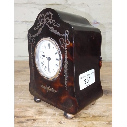 261 - An Edwardian silver inlaid tortoiseshell mantle clock, hallmarked silver hinged back, sponsor 'H.A&O... 