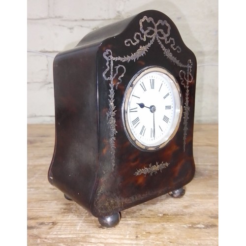 261 - An Edwardian silver inlaid tortoiseshell mantle clock, hallmarked silver hinged back, sponsor 'H.A&O... 