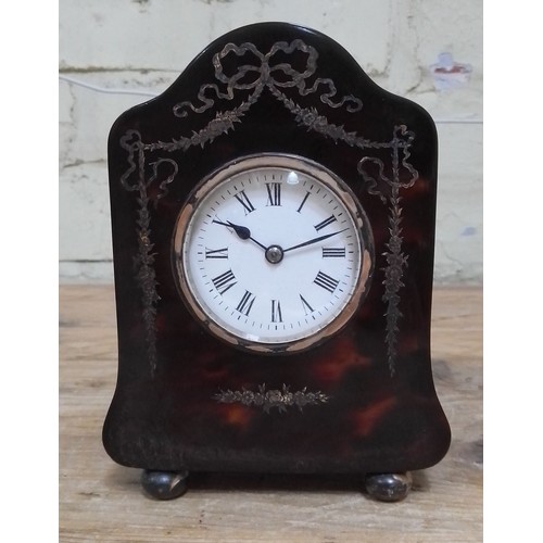 261 - An Edwardian silver inlaid tortoiseshell mantle clock, hallmarked silver hinged back, sponsor 'H.A&O... 