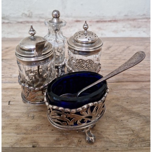 331 - A late Victorian hallmarked silver cruet stand with 3 cut glass pots and cobalt blue liner, gross wt... 