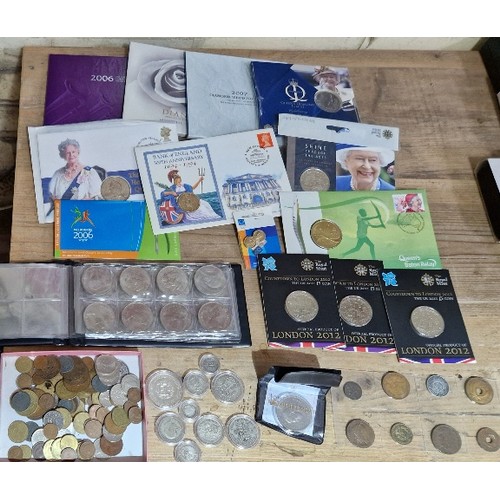 323 - A collection of assorted coins to include various covers, some silver coins, commemorative crowns & ... 