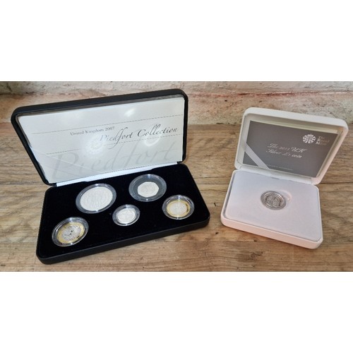 321 - Royal Mint, Two silver coins/sets comprising of a 2007 Piedfort collection, proof quality, (five pon... 