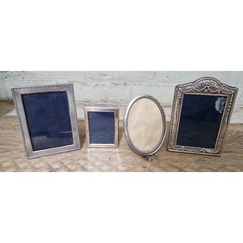 344 - A group of four silver photo frames, various marks.