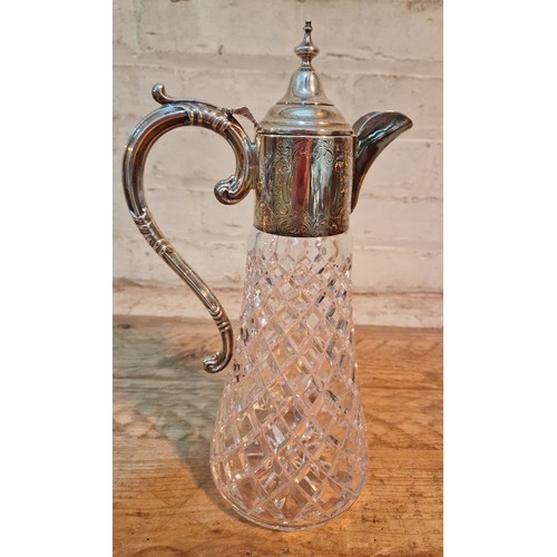 348 - A silver mounted crystal claret jug, Birmingham, Charles S Green & Co Ltd, 1975.