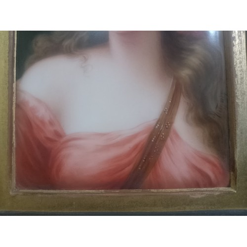 267 - A continental porcelain plaque, circa 1900, hand painted portrait depicting a girl, indistinctly sig... 