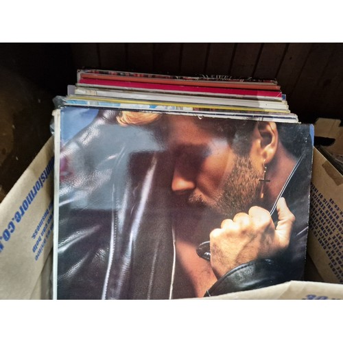 77 - A box of rock and pop LPs including George Michael. Wham!, etc