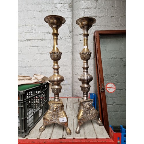 80 - A pair of large floor standing ecclesiastical candlesticks, height 58cm, approximately 2.6kg each.