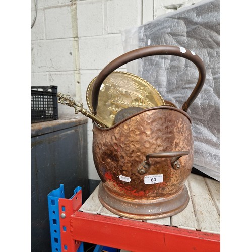 83 - A copper coal scuttle with various brass and copper items to include charger, etc.