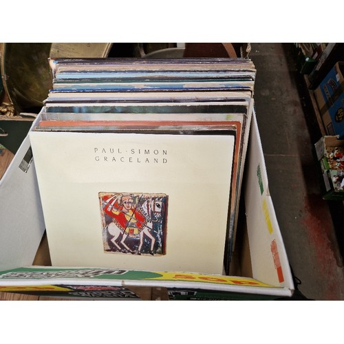 93 - A box of rock LPs including Paul Simon Graceland, etc.