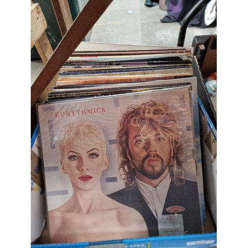 103 - A box of rock and pop LPs to include Eurythmics, Simply Red, etc.