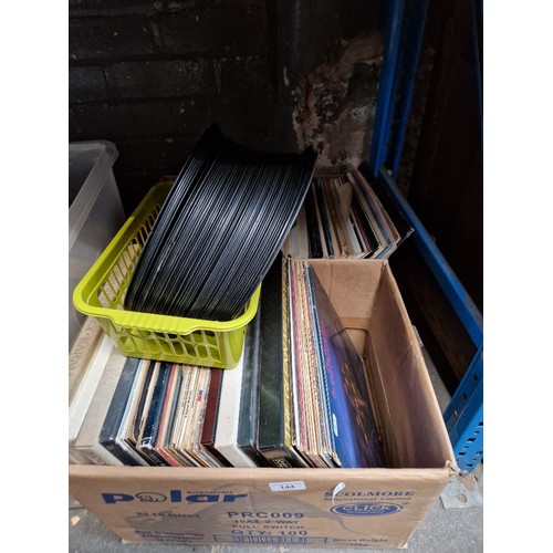 144 - Two boxes of vinyl LP records, various artists and genres including Moody Blues, Motown, Tom Petty, ... 