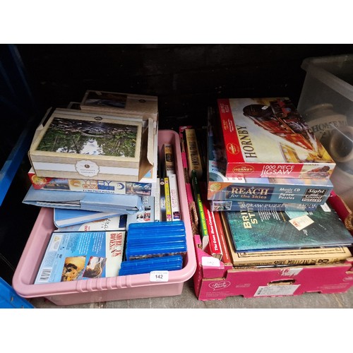 142 - Two boxes of mixed books, Olympic memorabilia, DVDs & jigsaws etc.