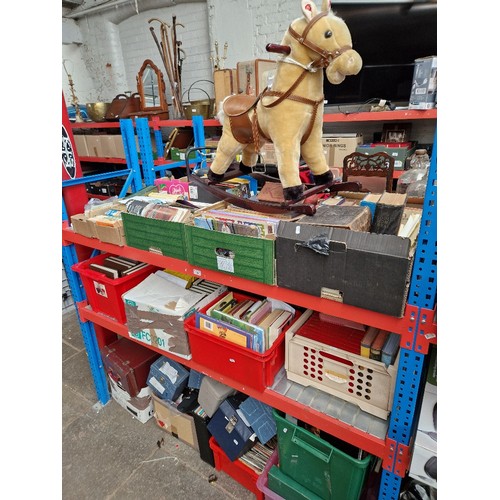 165 - 9 boxes of books & a childs musical rocking horse.