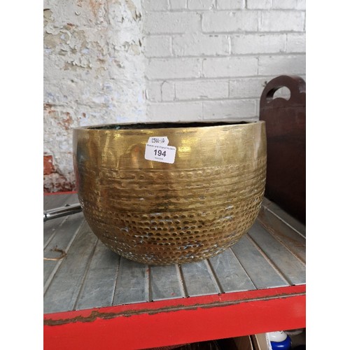 194 - A large brass bowl