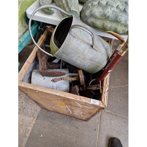 211 - A tea chest of assorted items to include galvanised watering can, shoe last, coal bucket & walking s... 