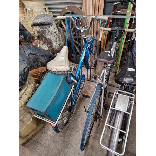 220 - A vintage Raleigh 20 bike with whitewall tires and rear rack.