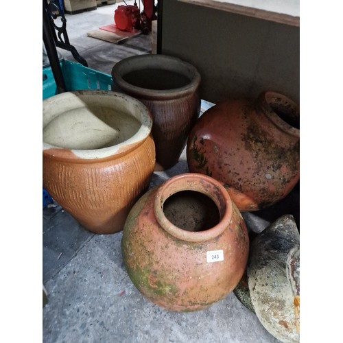 243 - 4 medium sized terracotta planters