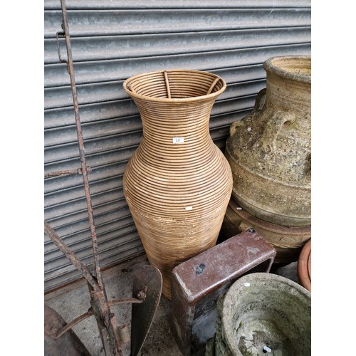 231 - An very large Indonesian Rattan vase and a brown Belfast sink.