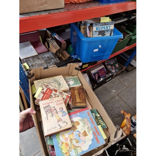 266 - Four boxes of assorted books to include Rupert annuals, including a 1970 copy, Beatrix Potter & a bo... 